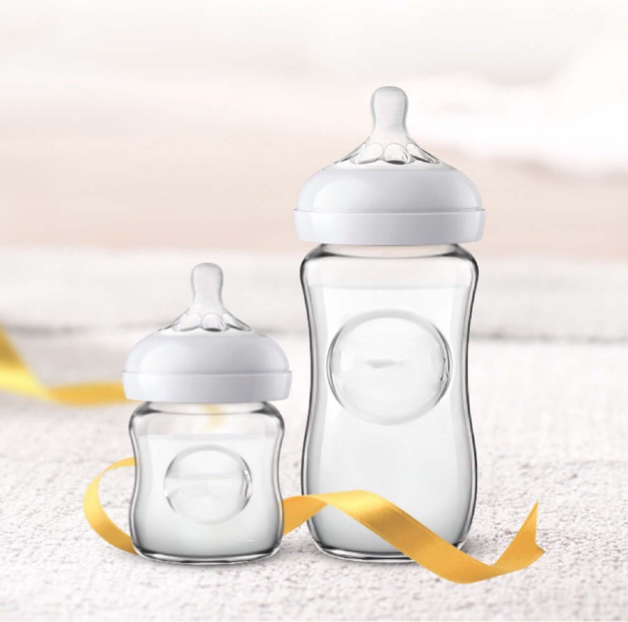 Two transparent baby bottle