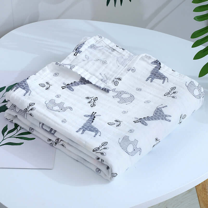 Breathable multi-use blanket in gray giraffe and elephant design