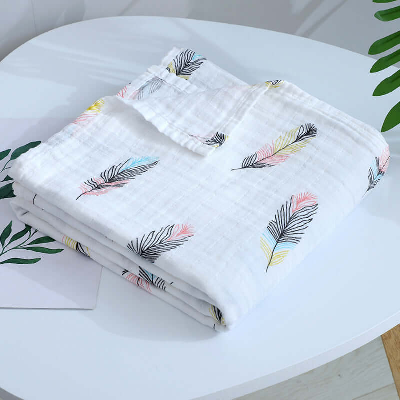 Breathable multi-use blanket in colorful feathers design